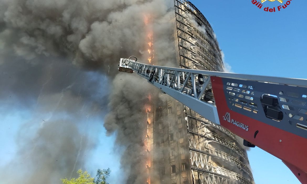 Fire rages through Milan residential tower block