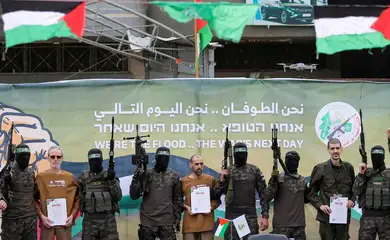 Or Levy, Eli Sharabi and Ohad Ben Ami, hostages held in Gaza since the deadly October 7, 2023 attack, are released by Hamas militants as part of a ceasefire and a hostages-prisoners swap deal between Hamas and Israel in Deir Al-Balah in the central Gaza Strip, February 8, 2025. REUTERS/Hatem Khaled     TPX IMAGES OF THE DAY