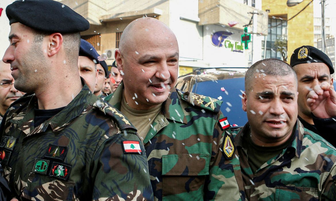 FILE PHOTO: Rice is thrown on Newly-appointed General Joseph Aoun (C) as army commander, upon his arrival at his family's house in Sin El Fil, northeast of Beirut, Lebanon March 8, 2017. REUTERS/Mohamed Azakir//File Photo