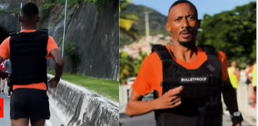 Weslley Caitano corre usando um coleta à prova de balas como protesto contra o racismo